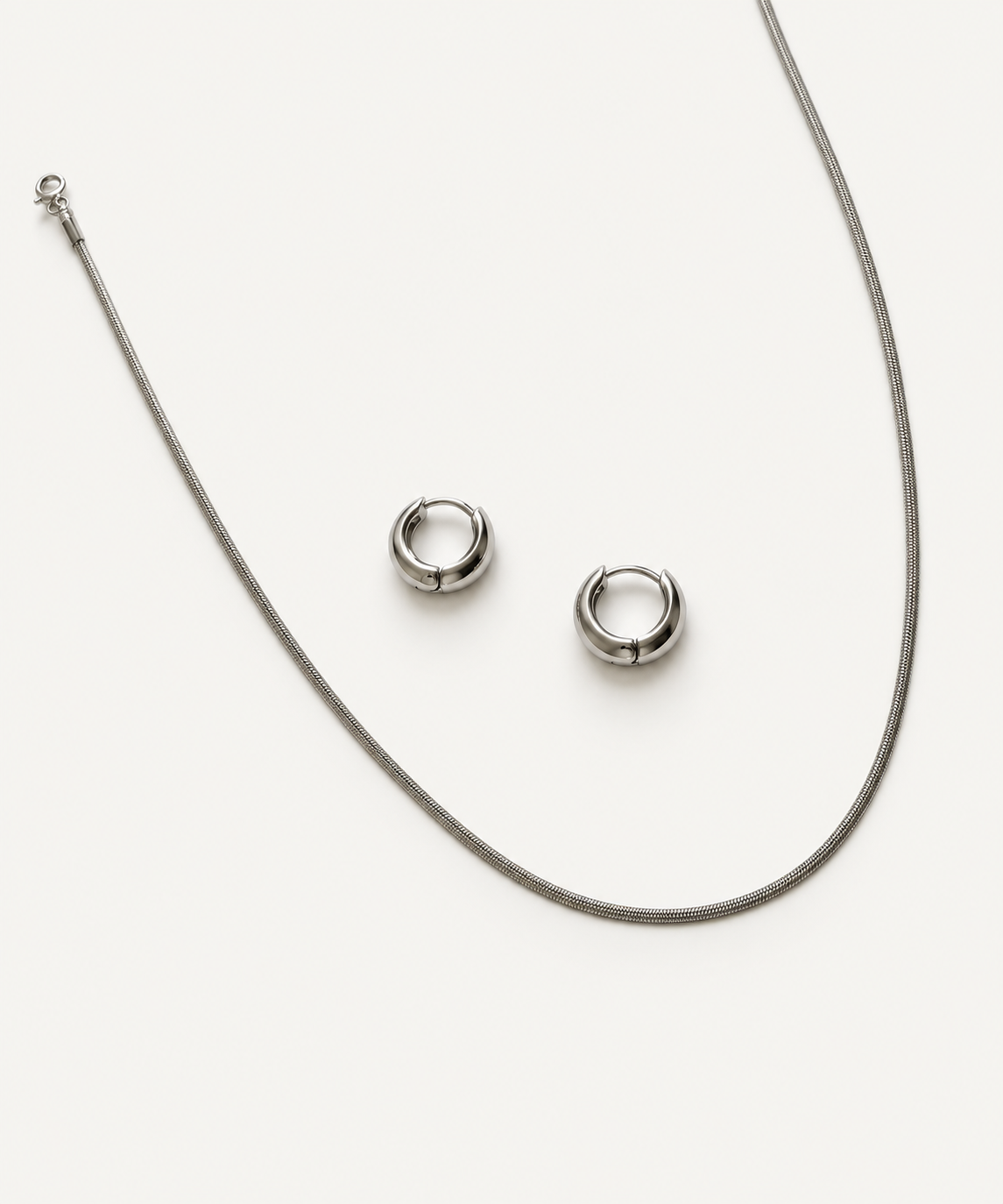 silver finish necklace with huggies