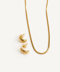 Twisted Huggie Earrings in gold with necklace