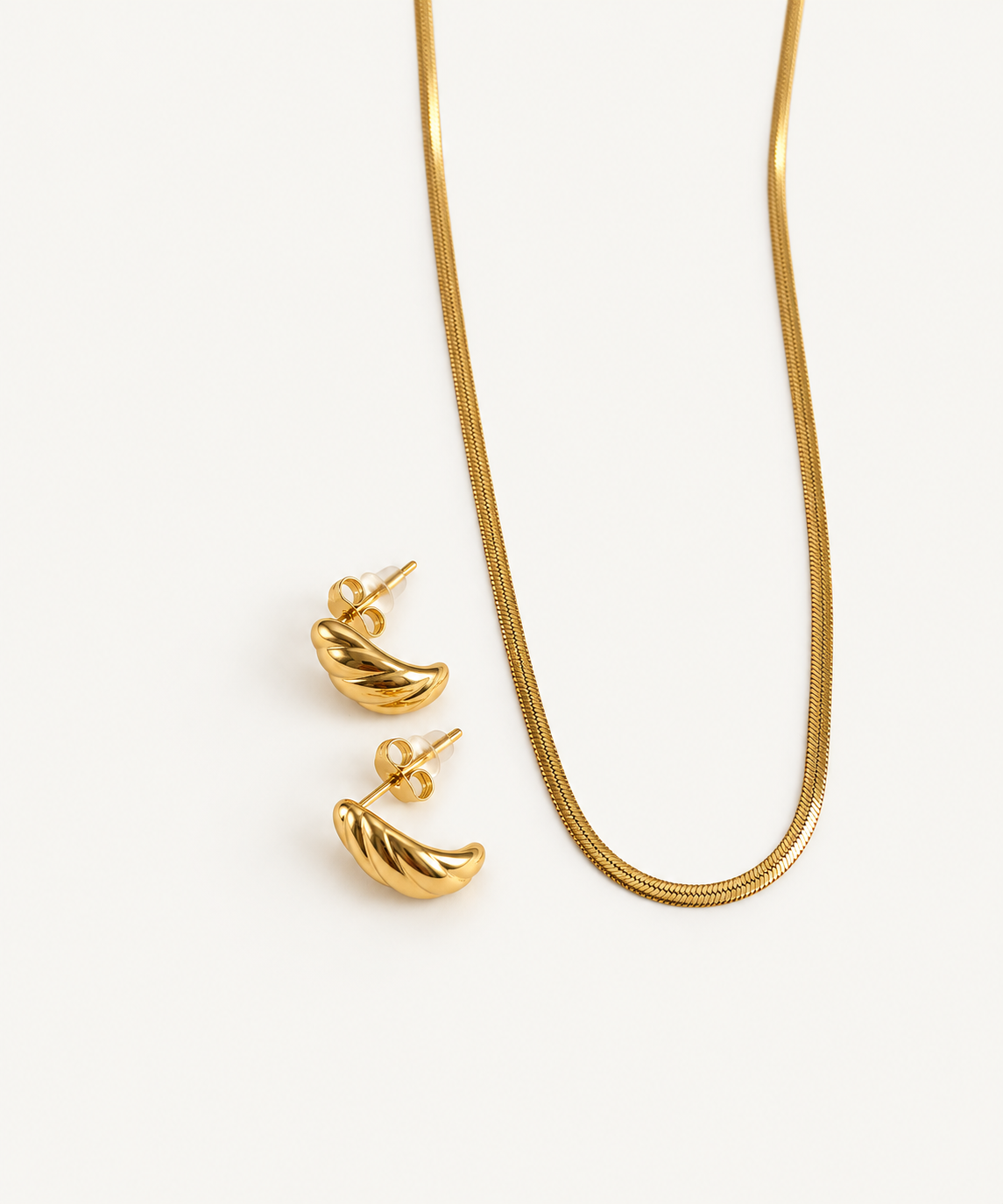 Twisted Huggie Earrings in gold with necklace